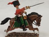 figurine of a man on a horse with a sword in his hand