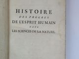 an open book on a table with a white background
