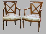 pair of antique wooden chairs with upholstered arms and upholstered arms