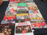 a table that has a bunch of different album covers on it