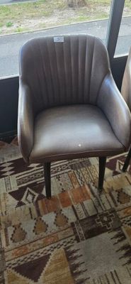 two chairs that are sitting in front of a window
