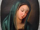 une image représentant un tableau d'une femme portant un voile vert