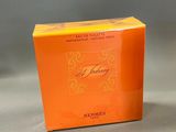 a close up of a box of perfume on a table