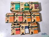 several packages of coffee are stacked on top of each other