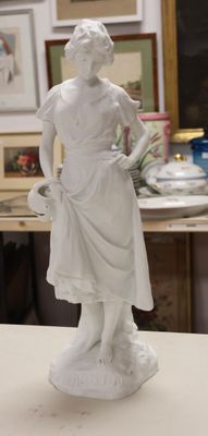 a statue of a woman standing on a table