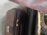 several pieces of luggage sitting on top of a table next to each other