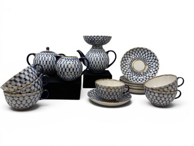 a group of blue and white dishes and cups and saucers