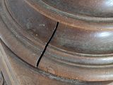 a close up of a clock on a pedestal