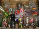 a cardboard box filled with many different types of sodas