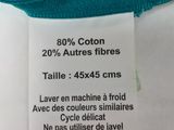 a label on the back of a knitted sweater