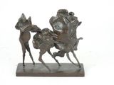 bronze statue of a man riding a horse with a woman on it