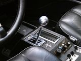 a close up of a car ' s interior with a steering control