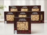 four boxes of all natural feed are sitting on a table