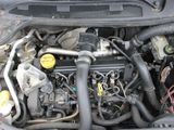 a picture of a car engine with its hood open