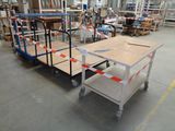a cart with a table on it in a warehouse