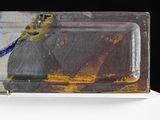 a glass plate with a bird on it on a table