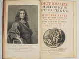 an old book with a picture of a man sitting on a chair