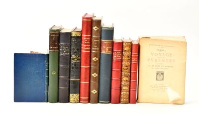 several old books are lined up on a shelf in front of a white background
