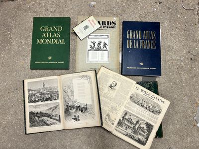 several old books are sitting on the ground next to each other