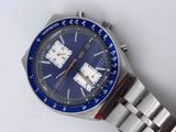 a watch that is sitting on a white surface