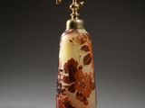 an image of a glass bottle with flowers on it