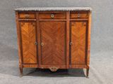 an antique wooden cabinet with marble top and two doors