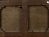 an old wooden cabinet with two doors and a sign on it