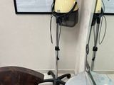 a hair dryer sitting on a chair in front of a mirror
