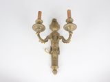pair of antique brass wall sconces on a white background