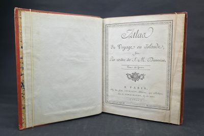 an old book opened to reveal a page with writing on it