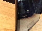 a cell phone that is sitting on a wooden table