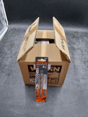 a cardboard box that has a pair of scissors in it