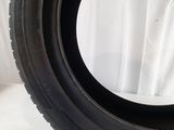 a close up of a tire on a white surface