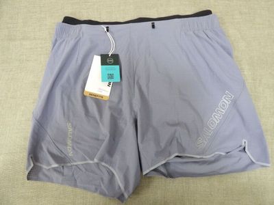 the shorts are gray and black with a tag on it