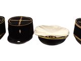 three hats sitting next to each other on a white surface