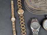 a lot of watches and other items that are on the table