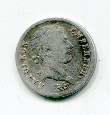 an old silver coin with a woman ' s face on it