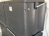 two boxes stacked on top of each other in a room