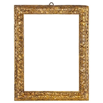 an old gold frame with a decorative pattern on a white background
