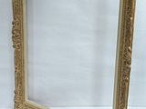 a gold frame with a white background and a white background