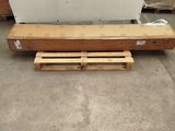 a wooden pallet sitting on the floor next to a wall