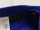 the back of a blue bag with a label on it