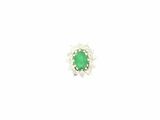 a close up of a green and white diamond ring