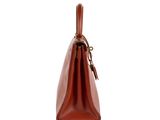 a brown leather handbag on a white background