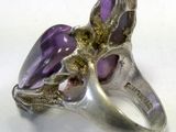 silver ring with amethorate and amethorate stones on it