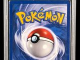 a close up of a card with a pokemon ball on it