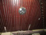 a picture of a bathroom that has a fan on the wall