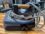 a machine that is sitting on top of a wooden table