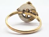 an image of a gold ring with a star in the middle of it