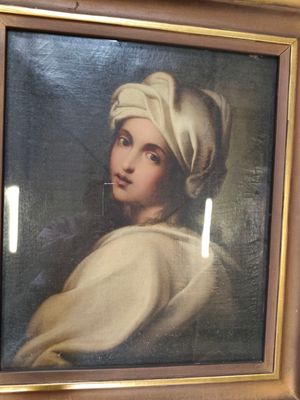 tableau représentant une femme portant un turban blanc, dans un cadre doré